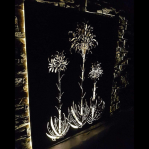 Gymea Lilies Wall Art in Rusted Steel with Lighting at Night