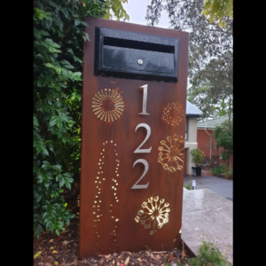 Ironbark Letterbox in Rusted Corten Steel with Agapanthas Pattern and Custom Stainless Steel Numbers- Figtree